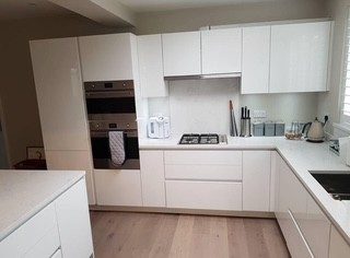 Finished kitchen: Doors aligned, splashback done, floor finished and sealed.