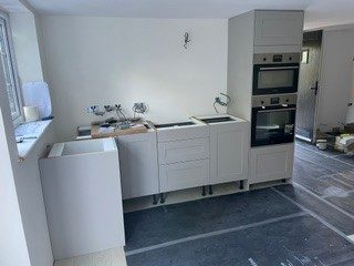Units set out: Tall housings and base units positioned, levelled and fixed.