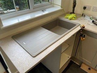 Sink and appliances: Sink, taps and appliances installed and connected.